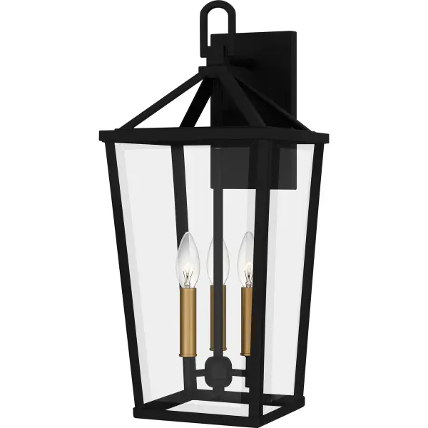 Hull is a traditional outdoor lantern collection designed for sleek exteriors. The tapered frame is finished in matte black and accented beautifully with gold candle sleeves for a hint of luster and industrial style. Clear beveled glass panels complete the look and showcase the natural beauty of the light. Hull is available as a complete collection - round out your home's exterior with a hanging lantern, wall lanterns, or a post lantern.