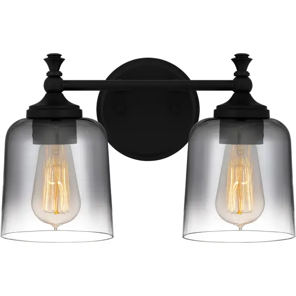 With its matte black finish and smoke glass shades, Jenson is the perfect complement to updated traditional design. Ombre smoke glass shades cast an alluring glow, while the clean lines of this bath light add in a dash of industrial appeal. Orient the glass shades facing up or down to suit your distinctive style.