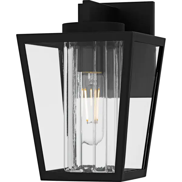 The Jett outdoor lantern collection incorporates transitional style with classic elements, making it a versatile choice for a variety of exteriors.  The stately silhouette features clean lines and a unique center glass column, all finished in a classic matte black.  Clear glass completes the look, offering a balance of visual intrigue and timeless style. Jett is available as a hanging lantern or in multiple sizes of wall light, perfect for flanking doorways, illuminating walkways, or accenting any outdoor space.