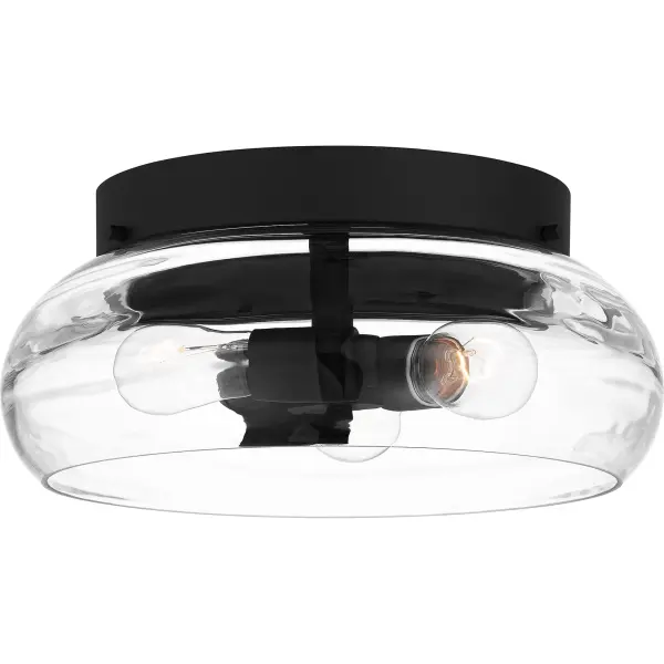Clear optic glass shades feature a rippling, wave-like pattern that evokes serene movement in the Lucy collection. Clean lines and a matte black finish complete the look, making Lucy a perfect complement to transitional or coastal inspired settings. Lucy is available as a flush mount, pendant light, chandelier, and multiple sizes of bath light.