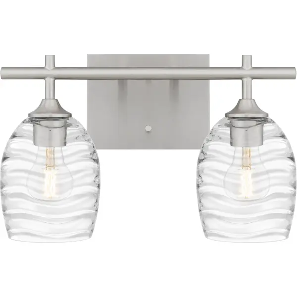 Clear optic glass shades feature a rippling, wavelike pattern that evokes serene movement in the Lucy bath light. Clean lines and a matte black finish complete the look, making Lucy a perfect complement to transitional or coastal inspired settings. Install with shades facing up or down - whichever best suits your preference.