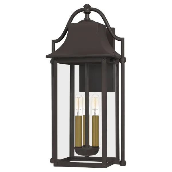 Bring a welcoming glow to your home's entrance with the Manning collection. This traditional style lantern is finished in Western Bronze and gives off an old gaslight feel. The clear glass panels allow for an unobstructed view of the light's interior which features  Weathered Brass candsleeves for a unique, dual-tone look.