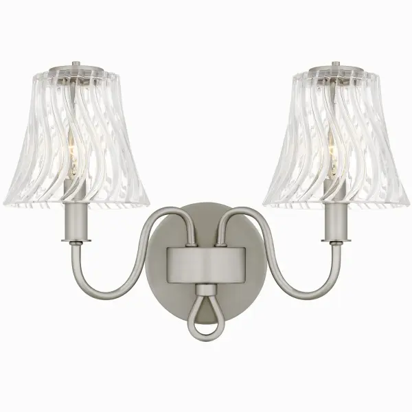 With its traditional styling and clean lines, McKinney is a perfect addition to any bathroom vanity setting. Choose from a brushed nickel finish with clear swirl glass or a matte black finish with etched swirl glass. The glass shades feature a fun twist design, adding a touch of texture and creating a captivating focal point. McKinney is available in multiple size options, allowing you to elevate any bathroom space with ease.