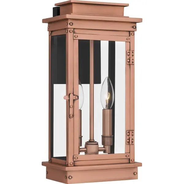 Inspired by traditional lanterns, Noelle adds a new twist to a classic design. The slender silhouette is crafted from weather-resistant aluminum and finished in aged copper. Clear glass panels showcase the sleek candle sleeves, making Noelle outdoor wall lights a perfect choice for a front door or porch setting. Collection: Noelle Rooms: Outdoor Finish: Aged Copper Glass: Shade 1: Clear Glass - Shade 2: Clear Tempered Glass Width: 7.50" Height: 15.50" Length: 6.00" Weight: 6.51 lb Extension from Wall: 6.00" Wire: 6" Canopy: 4.500"x7.000" Number of Bulbs: 2 Maximum Wattage: 15.00 W Bulb Type: Candelabra Bulb Base: Candelabra Voltage: 120.00 V Material: Aluminum Safety Listing: ETL Spec Sheet Instructions