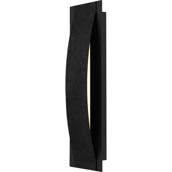 The Onyx outdoor wall sconce adds a touch of contemporary luxury to your home's exterior. The gently curved silhouette is finished in a sophisticated earth black and complemented by a unique textured front panel that resembles concrete. This textural detail adds visual interest and dimension to the design, while the integrated LED light source shines brightly through the sides. Flank your front door with a pair of Onyx wall lights - or use as a porch light to create the perfect outdoor setting.