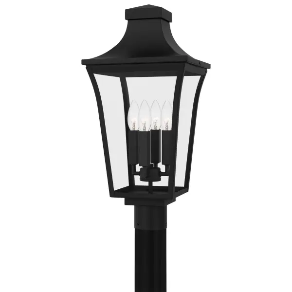 The Quentin post lantern delivers traditional outdoor lighting with a tapered frame and earth black finish. Clear glass panels showcase the bulb's warm glow, making it ideal for entryways and patios.
