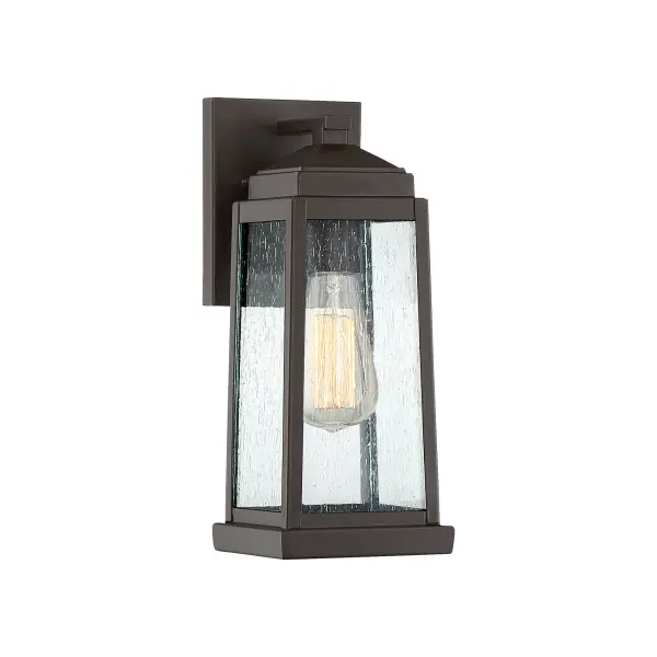 The Ravenel's classic silhouette features an updated design that combines understated elegance and quality craftsmanship. A gently tapered frame in Western bronze features generous panels of seedy glass that diffuse the soft glow of the light inside. Vintage bulbs provide additional warmth to this already inviting collection.