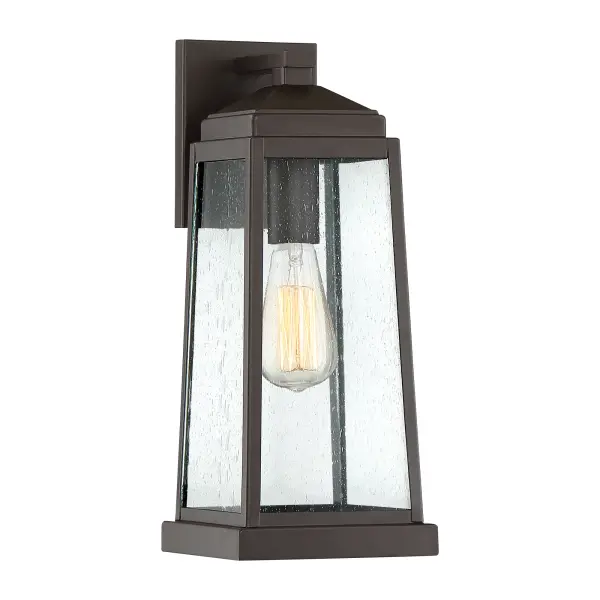 The Ravenel's classic silhouette features an updated design that combines understated elegance and quality craftsmanship. A gently tapered frame in Western bronze features generous panels of seedy glass that diffuse the soft glow of the light inside. Vintage bulbs provide additional warmth to this already inviting collection.