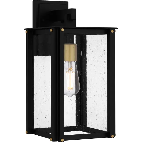 Robbins outdoor lanterns combine a classic silhouette with industrial style details. Gold decorative accents add a hint of luster to the matte black frame, while clear seedy glass panels maximize illumination and intrigue. Robbins is available as a post lantern or in multiple sizes of wall light, perfect for illuminating a front porch or landscape.