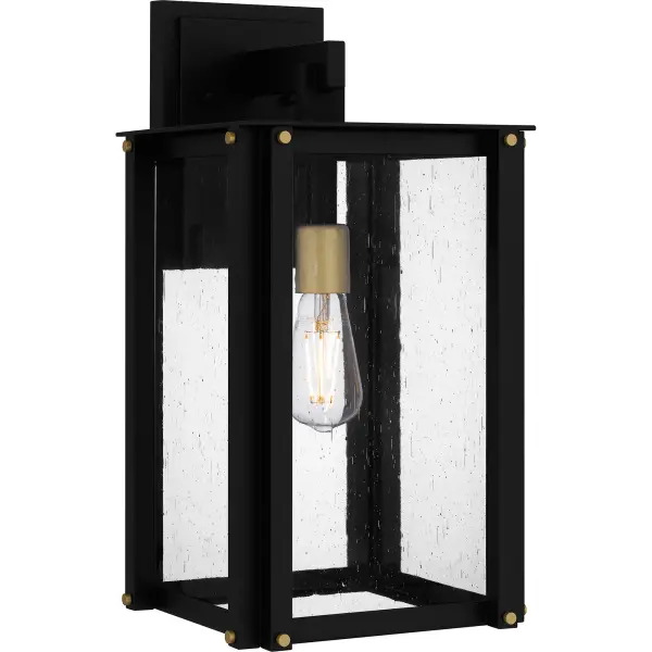 Robbins outdoor lanterns combine a classic silhouette with industrial style details. Gold decorative accents add a hint of luster to the matte black frame, while clear seedy glass panels maximize illumination and intrigue. Robbins is available as a post lantern or in multiple sizes of wall light, perfect for illuminating a front porch or landscape.