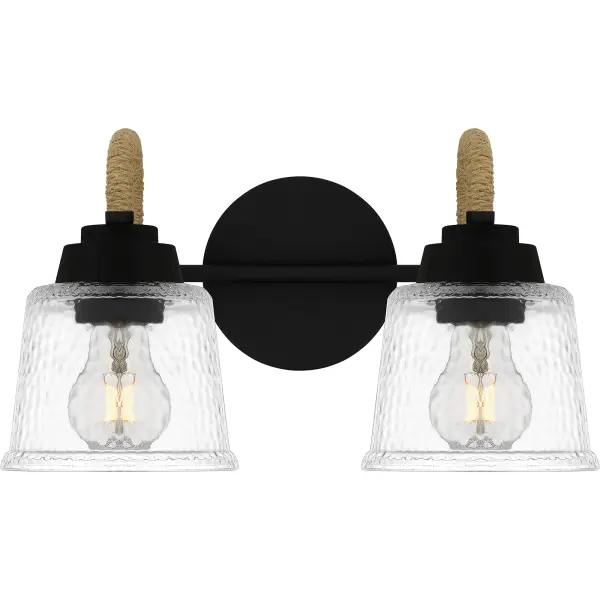 Upgrade any bathroom vanity with the addition of Seabreeze. This coastal-inspired bath light collection features clear hammered glass shades and a matte black finish. A natural looking arm takes the place of traditional metal, adding a nautical feel. Install Seabreeze with shades facing upwards or downwards, whichever best suits your unique space.