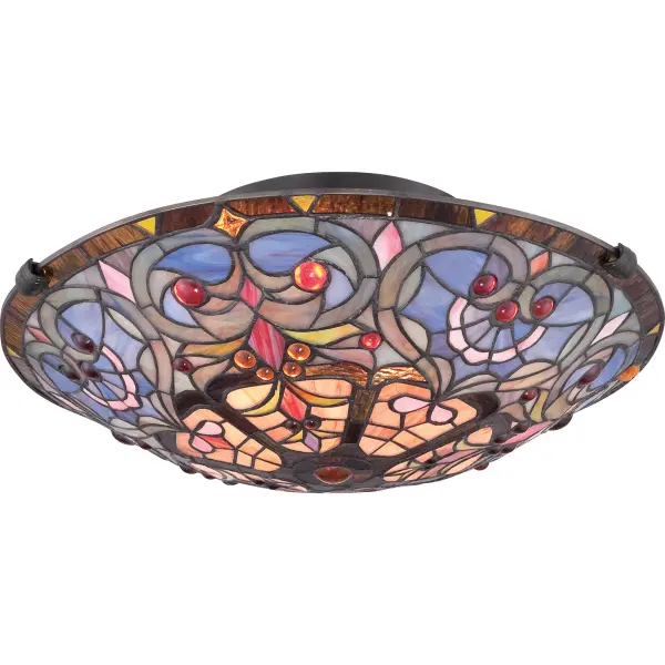 A staple of stained glass that will forever be in style, the Carroll Collection features an arrangement of art glass that evokes a heart pattern accented with jewels in red and amber.  The Vintage Bronze finish completes the look.Glass color in Tiffany lighting products vary in color.  No two pieces are identical.