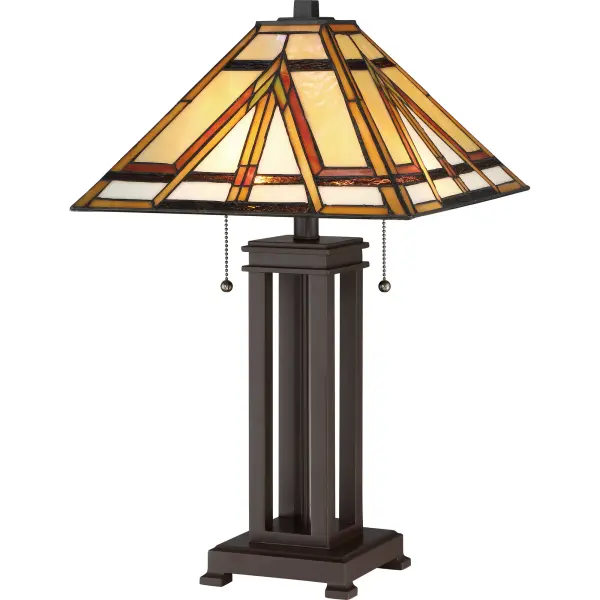 The Gibbons table lamp perfectly embodies the craftsmanship of Tiffany design. The earth-tone hues of the shade are perfectly arranged in a classic Mission style and the solid base features a Russet finish.Glass color in Tiffany lighting products vary in color. No two pieces are identical.
