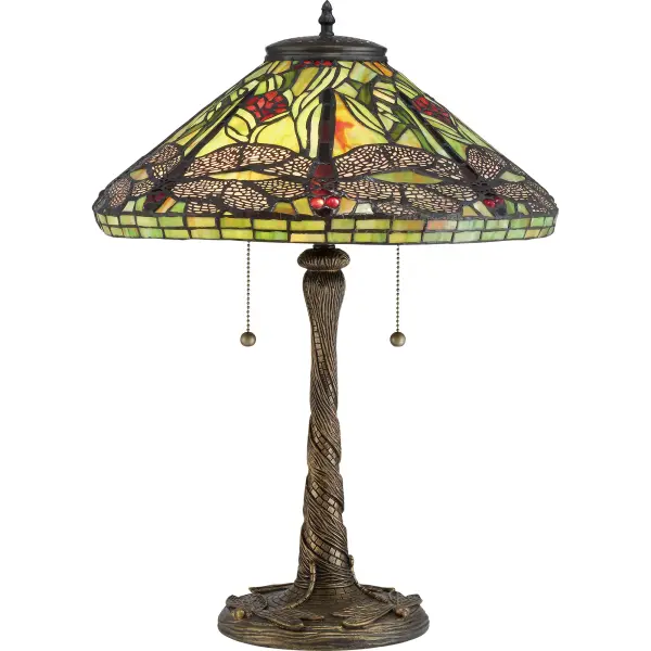 With varying shades of green and splashes of rich red, the Jungle Dragonfly table lamp is the perfect Tiffany style.  The intricate cut-outs on the metal wings showcase the beauty of the glass and the dragonfly motif on the shade.Glass color in Tiffany lighting products vary in color.  No two pieces are identical.