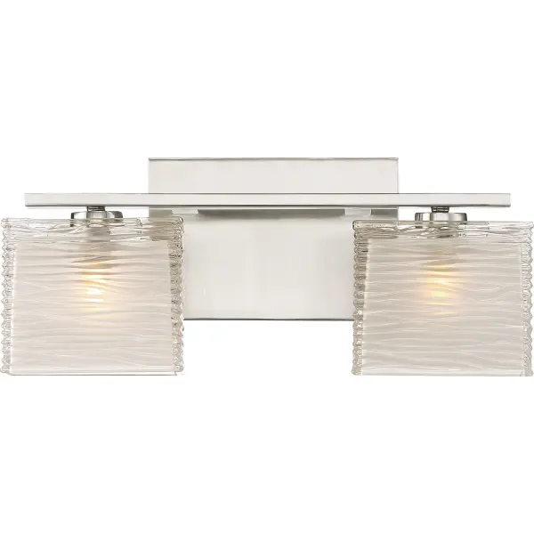 With a unique glass pattern and simple base, the Westcap bath light collection is contemporary with a twist. The beautiful waving pattern of the thick clear glass is accented by the sandblasting on the inside of the shades, creating a unique spa-like ambiance for your home bathroom. Choose from multiple size options and two classic finishes to complete the look; Westcap is available in polished chrome, brushed nickel, or matte black.