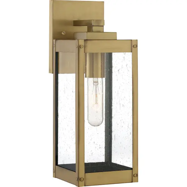 The clean lines and hand-riveted accents make the Westover lantern collection a modern industrialist's dream. A long rectangular framework  provides an unobstructed view of the lantern's sleek interior. The choice of earth black, antique brass, industrial bronze, stainless steel, or western bronze further enhances the versatility of this refined collection. The earth black, stainless steel, and western bronze finishes show off clear beveled glass panels while the antique brass and industrial bronze options flaunt seedy glass.