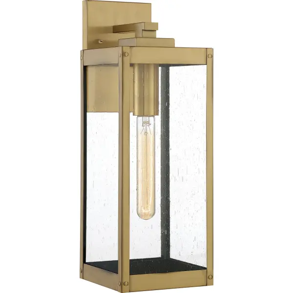 The clean lines and hand-riveted accents make the Westover lantern collection a modern industrialist's dream. A long rectangular framework  provides an unobstructed view of the lantern's sleek interior. The choice of earth black, antique brass, industrial bronze, stainless steel, or western bronze further enhances the versatility of this refined collection. The earth black, stainless steel, and western bronze finishes show off clear beveled glass panels while the antique brass and industrial bronze options flaunt seedy glass.