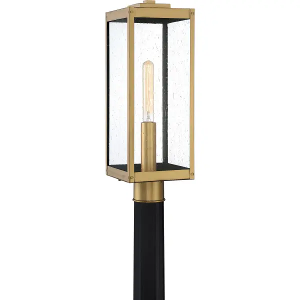 The clean lines and hand-riveted accents make the Westover lantern collection a modern industrialist's dream. A long rectangular framework  provides an unobstructed view of the lantern's sleek interior. The choice of earth black, antique brass, industrial bronze, stainless steel, or western bronze further enhances the versatility of this refined collection. The earth black, stainless steel, and western bronze finishes show off clear beveled glass panels while the antique brass and industrial bronze options flaunt seedy glass.