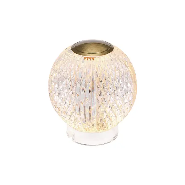Introducing the latest masterpiece in our bestselling Marni collection - the Marni portable lamp. This stunning lamp marries modern elegance with timeless beauty, elevating any space it graces. With two available sizes and two exquisite finishes, Vintage Brass and Polished Nickel, you can customize your decor effortlessly. Experience the convenience of easy tap on/off and dimming, all powered by a rechargeable battery, making it a truly portable and practical addition to your home. Illuminate your life with the Marni portable lamp, where sophistication meets functionality. Collection: Marni Designer: Ryan Pauly Finish: Natural Brass Glass: Clear Carved Acrylic Notes: LI-Battery Width: 3.63" Height: 3.63" Length: 3.63" Wire: Black Charger Canopy: D2.25" x H0.75" Charging Base Only Maximum Wattage: 1.50 W Bulb Type: LED Light Source: LED Light Output: 150.00 lm Delivered Lumens: 100.00 lm Color Temperature: 3000 K CRI: 90 Rated Average Life: 50,000 Material: Steel + Acrylic Country of Origin: China Safety Listing: ETL Safety Rating: Damp LED Spec Sheet Instructions