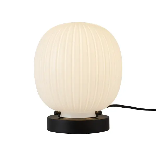 Step into nostalgia with the Cherise collection, inspired by the enchanting candy shops of the 1920s. Each bonbon-shaped ribbed opal glass shade casts a soft, inviting glow while infusing your space with delightful Art Deco charm. Elevate your decor with a sweet touch of vintage style! Collection: Cherise Designer: Peyton Fox Finish: Matte Black/Glossy Ribbed Opal Glass Glass: Glossy Ribbed Opal Glass Width: 6.75" Height: 8.25" Length: 6.75" Wire: 72" Black Canopy: D4.75" x H1" Number of Bulbs: 1 Maximum Wattage: 60.00 W Bulb Type: A19 Bulb Base: E26 Voltage: 120.00 V Material: Steel + Glass Country of Origin: China Safety Listing: ETL Safety Rating: Dry Spec Sheet Instructions