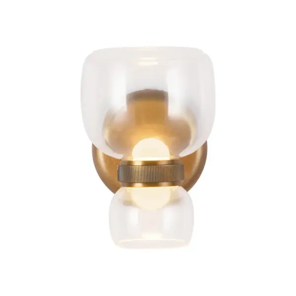 Designed by Elisa Carlucci for Alora Lighting, the Sutton sconce adds a touch of modern glamour to any space. Like the perfect earring completing an outfit, this sconce features a beautifully balanced design with a layered shade and refined metal detailing. Available in multiple finish combinations, Sutton's integrated LED offers five adjustable color temperatures to suit any mood. Perfect for hallways, powder rooms, bedrooms, or kitchens, the Sutton sconce brings effortless sophistication and warm, versatile illumination to your home. Collection: Sutton Designer: Elisa Carlucci Finish: Vintage Brass/Clear Glass Glass: Clear Glass Width: 5.38" Height: 7.63" Weight: 3.97 lb Extension from Wall: 7.25" Canopy: D5" x E1" Maximum Wattage: 11.00 W Light Source: LED Light Output: 890.00 lm Delivered Lumens: 465.00 lm Color Temperature: 2700 K CRI: 90 Rated Average Life: 50,000 Voltage: 120.00 V Material: Steel + Glass Country of Origin: China Safety Listing: ETL Safety Rating: Damp Title 24 LED Spec Sheet Instructions