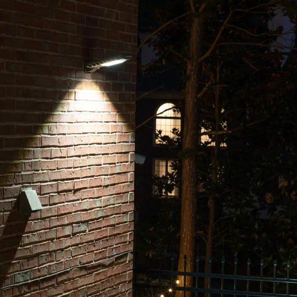 This 810-lumen solar-powered security light offers exceptional value for outdoor illumination without electrical costs. Features dual operation modes, integrated motion sensor with 140° detection, and programmable timer options. - alternate view