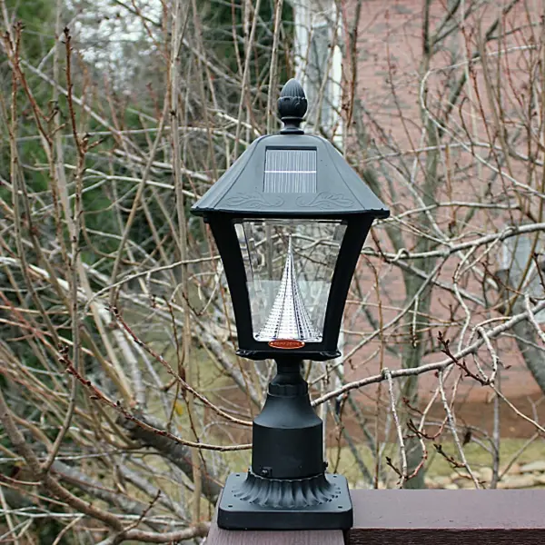 The Baytown Solar Light combines traditional lantern styling with modern solar technology. Features three mounting options, weather-resistant cast aluminum construction, and dual color temperature settings for flexible outdoor lighting. - alternate view