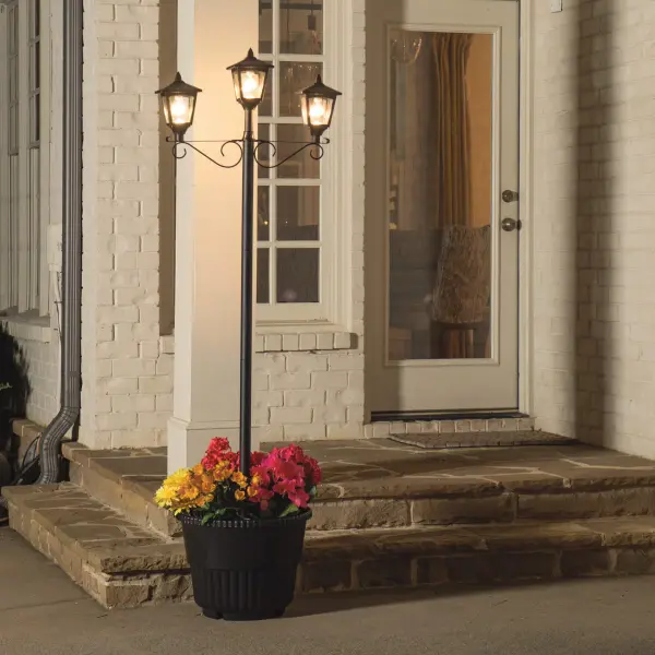 This eco-friendly solar lamp post combines functional pathway lighting with decorative planting capability. Three warm white LED heads provide 90 total lumens for up to 10 hours, powered entirely by solar energy with no wiring required. - alternate view