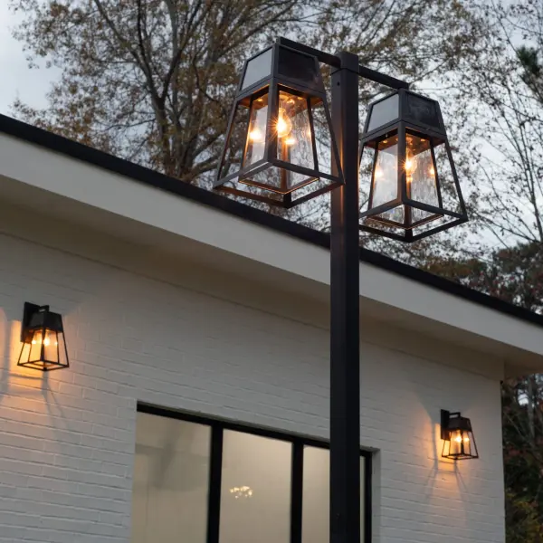 The Aria Solar Double-Head Post Light combines modern design with eco-friendly solar technology. No wiring required, this weather-resistant fixture provides up to 12 hours of warm white light with automatic dusk-to-dawn operation. - alternate view