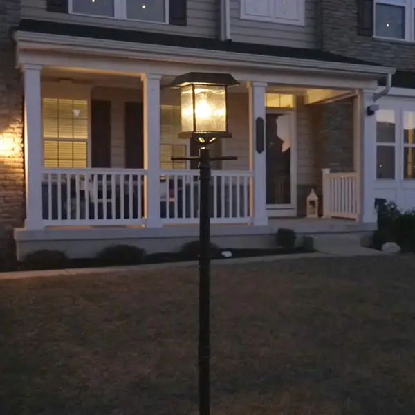 The Aspen Solar Lamp Post combines elegant traditional styling with modern solar technology. Features dual LED bulbs (warm white and flame effect), weather-resistant construction, and flexible installation with planter or ground mount. - alternate view