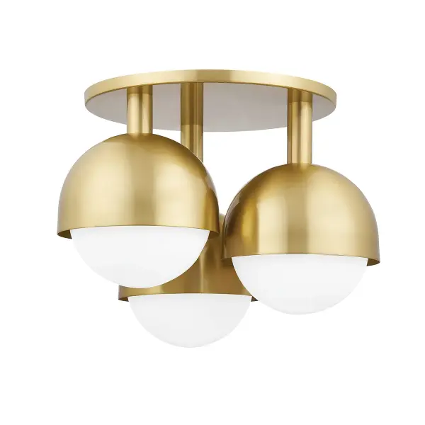 The Foster semi-flush mount combines transitional elegance with practical functionality. Its aged brass finish and opal glass shades deliver warm, diffused illumination perfect for lower ceilings.