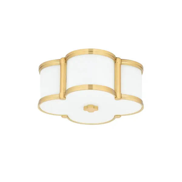 The Chandler flush mount combines timeless quatrefoil geometry with warm aged brass and custom opal glass. Its compact 12.5-inch profile delivers ambient lighting perfect for hallways, bedrooms, and smaller spaces.