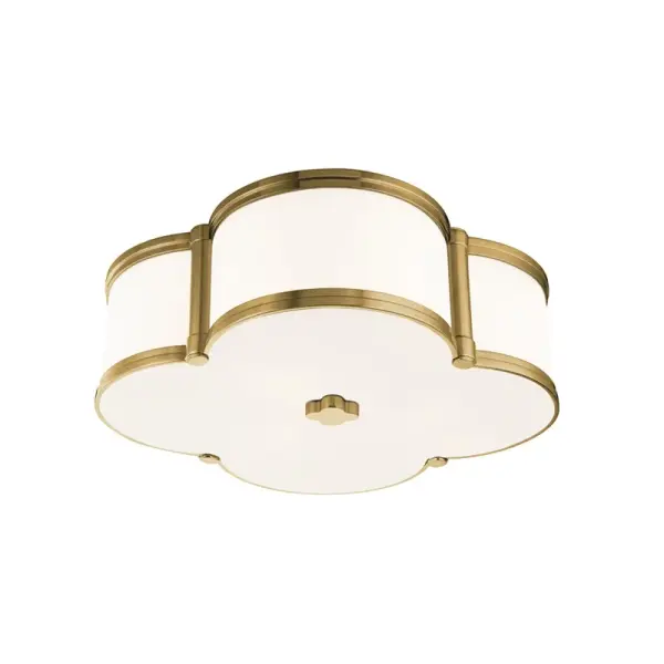 The Chandler flush mount combines cast metal craftsmanship with custom opal glass in a distinctive four-leaf clover pattern. Its low-profile design and warm ambient glow make it ideal for spaces with standard ceiling heights.