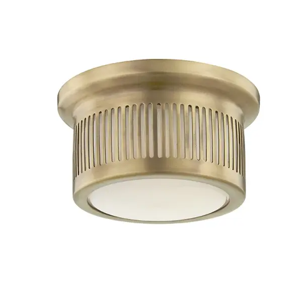 The Bangor is a petite flush mount that delivers efficient LED lighting in a refined package. Its aged brass finish and opal glass shade create soft, diffused illumination ideal for smaller spaces.