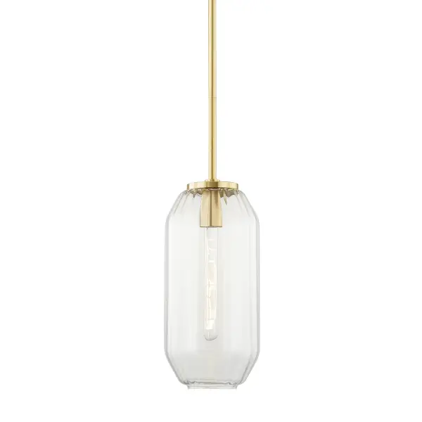 Bennett showcases exceptional glass craftsmanship with its octagonal ribbed shade and exposed carbon filament bulb. The Aged Brass finish adds warmth while the clear glass maximizes light output. Versatile sizing and adjustable height make it adaptable to various spaces.