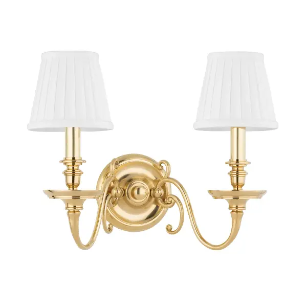 Charleston brings timeless colonial charm with its signature ball and scroll form, updated with clean lines and sophisticated pleated fabric shades. The aged brass finish adds warmth and character to traditional and transitional spaces.