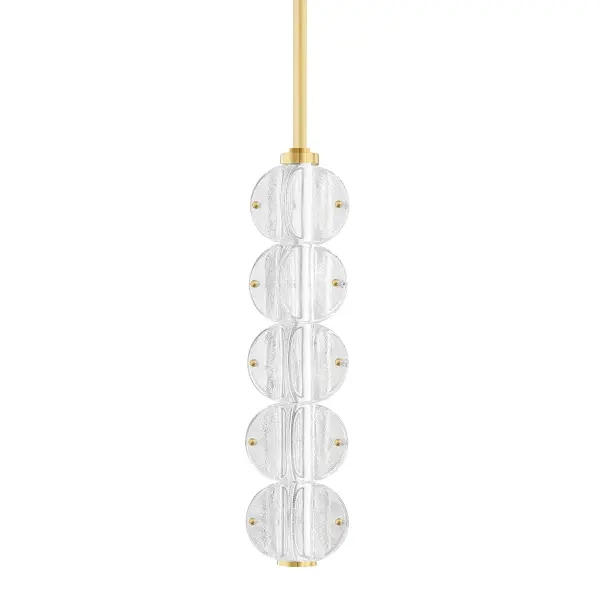 The Lindley pendant transforms functional lighting into wearable art with its distinctive glass disc design. Molded glass beads create a scalloped silhouette that catches light beautifully, while the aged brass finish adds warmth and sophistication.