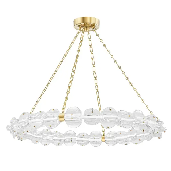 The Lindley combines jewelry-inspired design with architectural scale. Textured glass discs create a distinctive scalloped silhouette, while integrated LED delivers warm, efficient illumination. The 38-inch diameter commands attention without overwhelming.