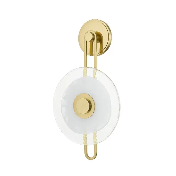 Keuka Park delivers modernist artistry with its distinctive earring-like design featuring a thick illuminated glass disc. The integrated LED provides warm, efficient lighting while the aged brass finish adds sophisticated warmth to contemporary interiors.