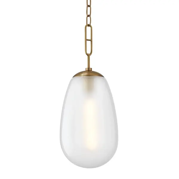The Bruckner pendant combines aged brass warmth with clean lines and etched glass for a refined industrial look. Its compact 8.75" diameter makes it ideal for smaller spaces or clustered installations over islands and bars.