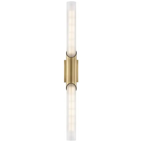 The Pylon wall sconce delivers clean, contemporary lighting with its slender vertical profile and aged brass finish. Perfect for flanking mirrors or creating symmetrical lighting in narrow spaces.