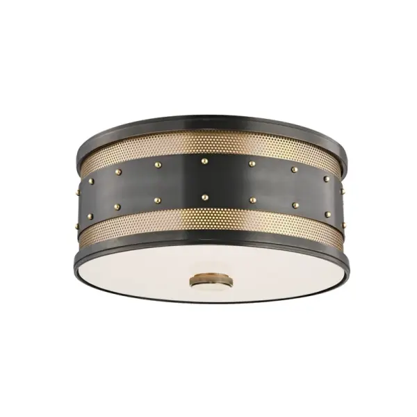 The Gaines flush mount delivers traditional elegance in a compact profile ideal for rooms with limited ceiling clearance. Its aged old bronze finish and etched glass shades provide warm, diffused light.