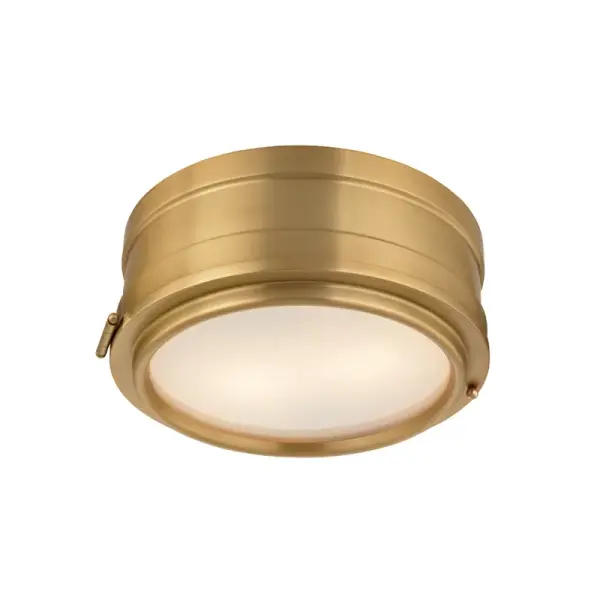 The Rye flush mount delivers understated elegance with its aged brass finish and etched glass diffuser. At 11 inches wide, it's perfectly sized for smaller spaces needing ambient lighting without visual bulk.
