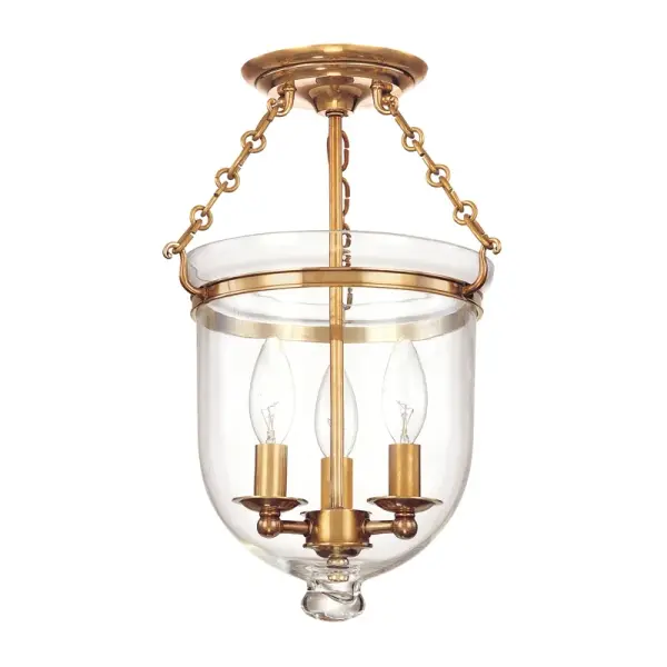 The Hampton semi-flush mount combines traditional elegance with practical functionality. Its compact 10.25-inch diameter and aged brass finish make it ideal for smaller spaces requiring ambient lighting with character.
