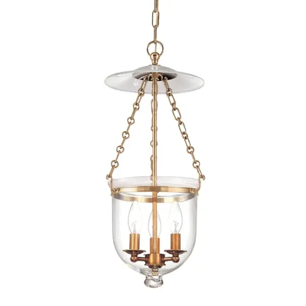 The Hampton pendant combines traditional brass craftsmanship with clear glass shades for a refined look that works in both classic and transitional spaces. Its compact 10.25-inch width makes it ideal for smaller areas.