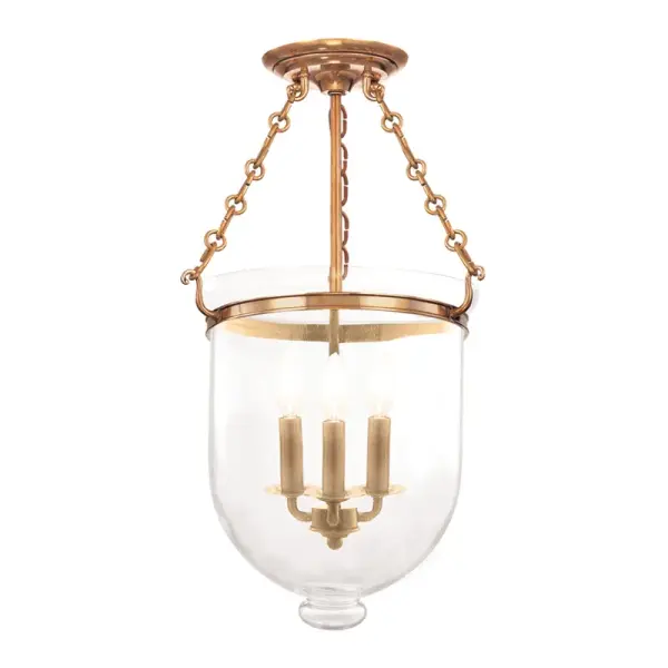 The Hampton semi-flush mount combines traditional elegance with practical ceiling clearance. Its aged brass finish and clear glass shades deliver warm ambient lighting ideal for spaces with lower ceilings.
