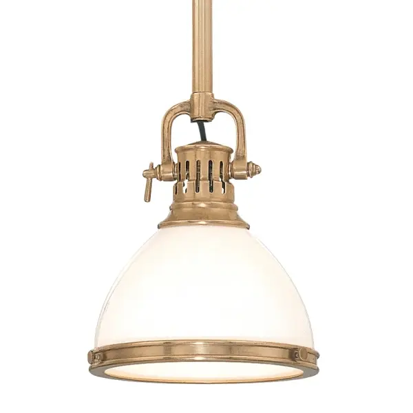 The Randolph pendant combines classic form with contemporary simplicity. Its aged brass finish and opal glass shade create warm, diffused light perfect for task and ambient applications. Highly adjustable stem system accommodates various ceiling heights.