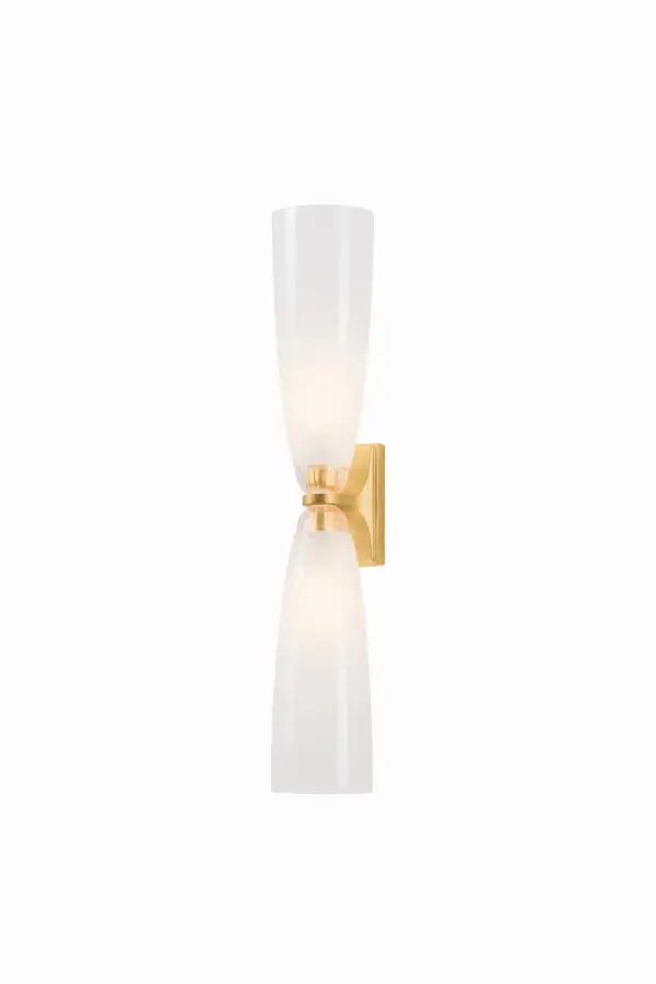 The Ravenswood sconce delivers timeless appeal with its balanced two-light design and translucent etched glass that creates an inviting glow. The vintage gold leaf finish adds upscale warmth, making it equally at home in bathrooms and hallways.