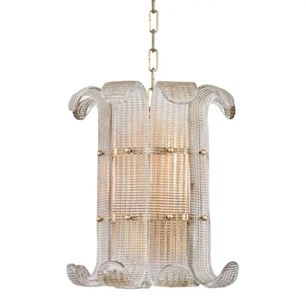 The Brasher pendant showcases hand-poured champagne-hued glass panels that refract light beautifully. Its textured glass diffusers and aged brass metalwork with spherical pins create an artisanal aesthetic that bridges traditional and contemporary design.