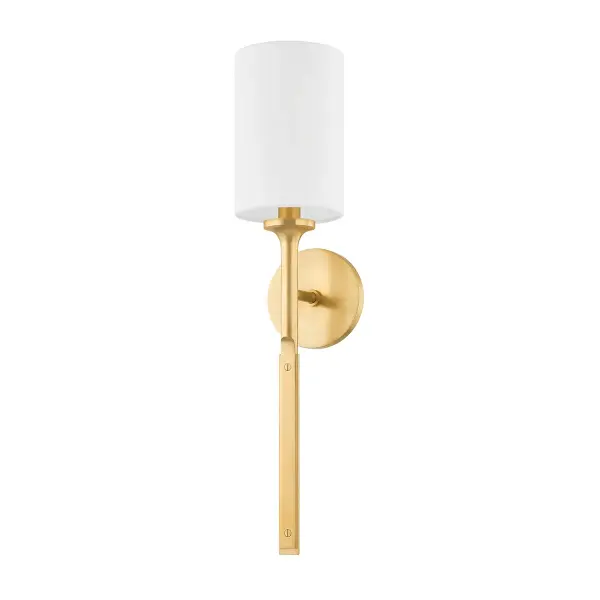 The Brewster wall sconce delivers refined modern style with its slim profile, clean lines, and monochromatic metal finish. Thoughtful details like faux nail heads and the transition from smooth to flat metal give it a jewelry-inspired, handcrafted feel that elevates any space.